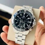 Brand Tag Heuer (7AAA First Copy) Model Aquaracer Calibre 5 Dial Size 45mm Dial Color Black Movement Type Japanese Quartz Display Type Analog with Chronograph Strap Material Stainless Steel